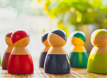 Multi-colored models stand together and discuss their work. Diverse group of stylish people standing together. Society or population, social diversity concepts. Multi-colored models stand together and discuss their work. Diverse group of stylish people standing together. Society or population, social diversity concepts.